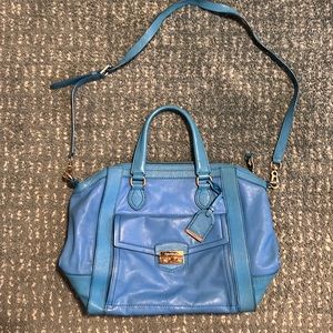 Cole Haan blue leather hand bag with shoulder strap.